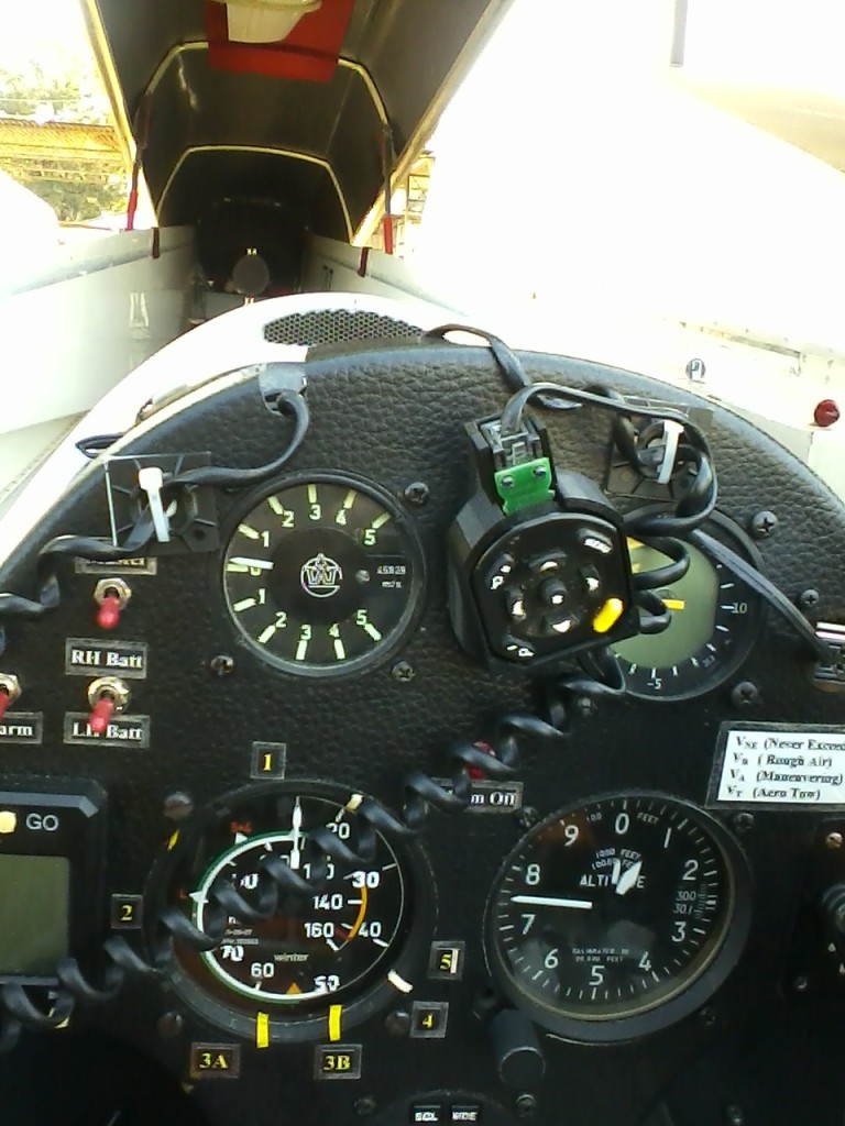 Remote caddy detached from flap grip and connected to 'garage' piece mounted to instrument panel using one of the instrument screws