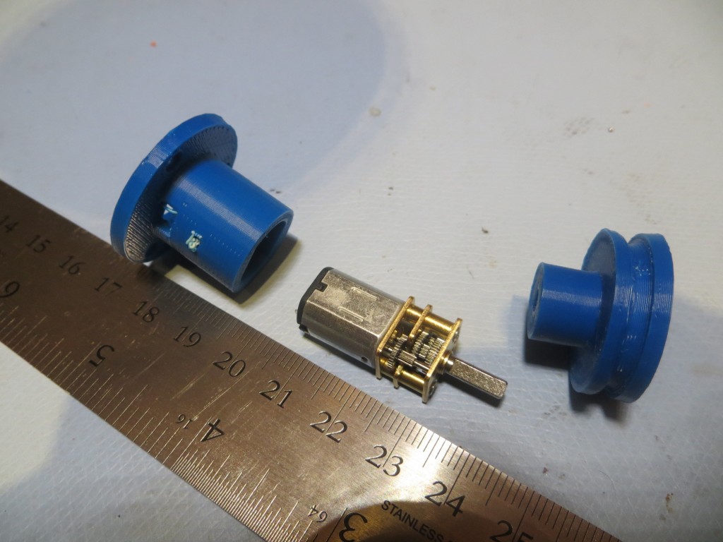 Miniature DC motor with chassis mount and belt drive wheel