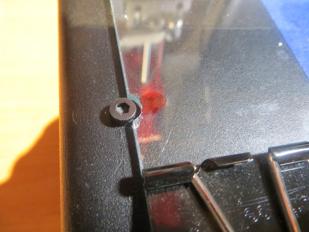Screw head cutouts ground with Dremel tool and small grinding bit