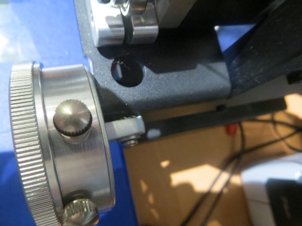 Dial indicator mounted to the extruder carriage. Note ground-down portion of the carriage . 
